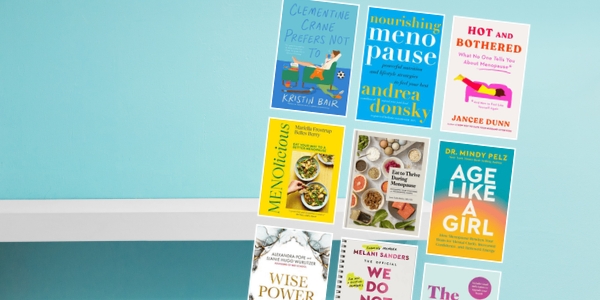 pale blue wall with white bookshelf with various book covers