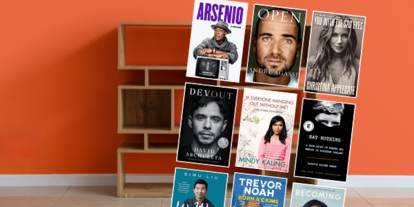 orange wall with a bookshelf with various book covers