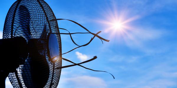 electric fan with sunny blue sky in background