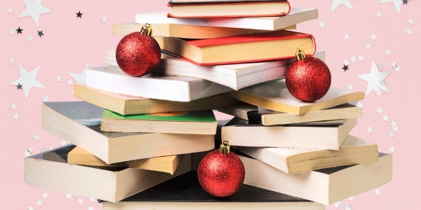 stack of books and three sparly ornaments