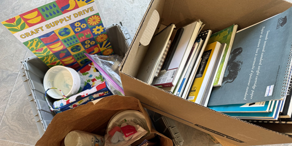 two boxes filled with donated craft supplies