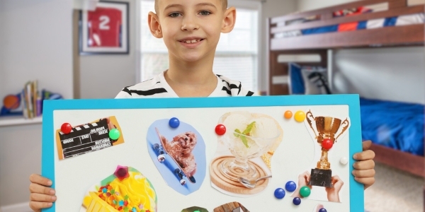 youth holding up a vision board