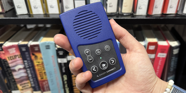 hand holding an Envoy Connect player