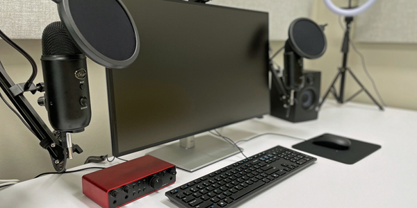 computer screen, keyboard, microphones