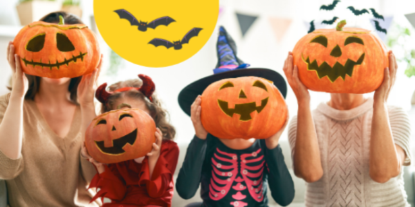 four people wearing Halloween costumes and holding jack o' lanterns in fron of their facess