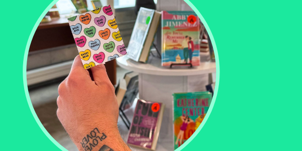 adult hand holding up a Valentine Card