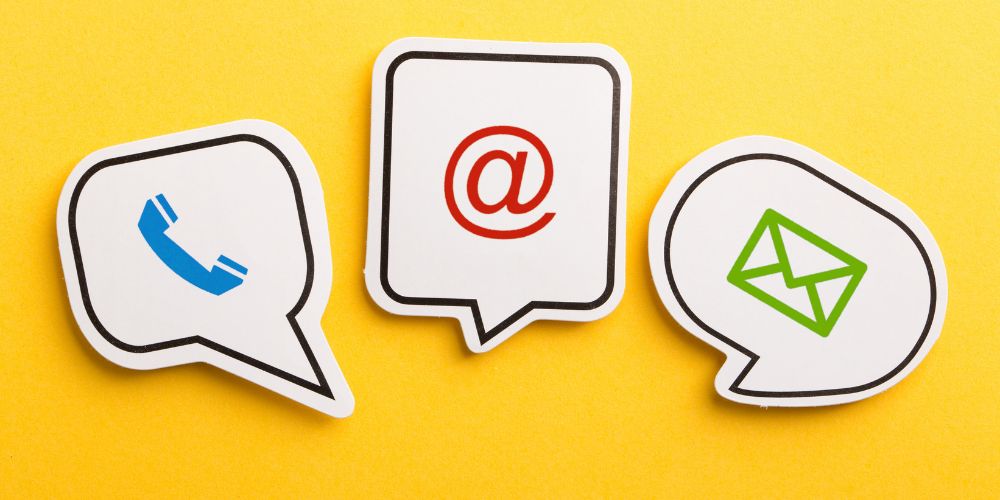 yellow background with speech bubbles featuring telephone, envelope, and email symbols