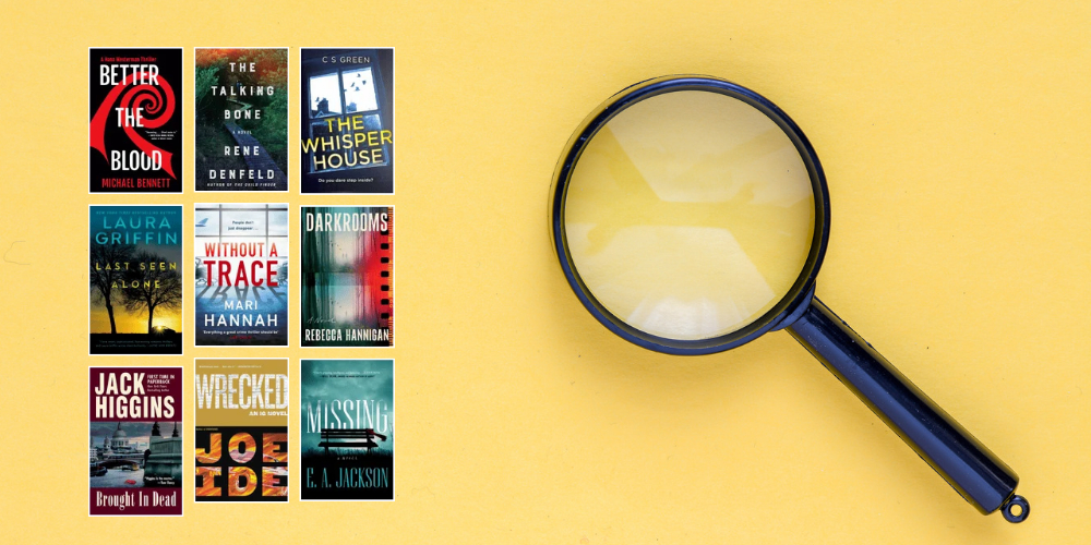 various book covers beside a magnifying glass