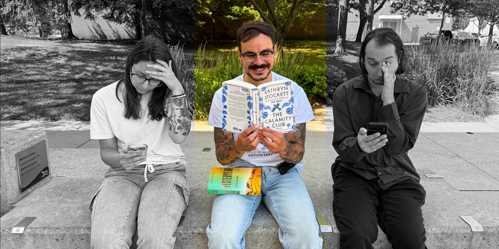 three adults sitting outside, two unhappily looking at their phones while the third is smlling and reading a book