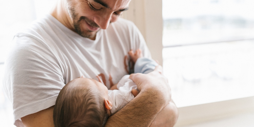 adult holding an infant