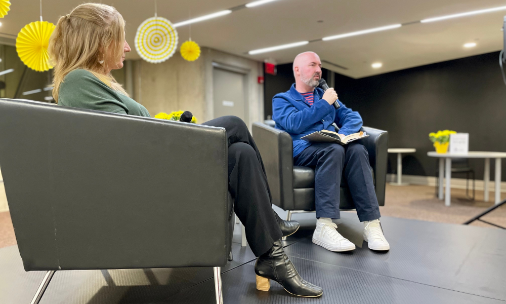 Lita Barrie listens to Douglas Stuart as he reads from Young Mungo