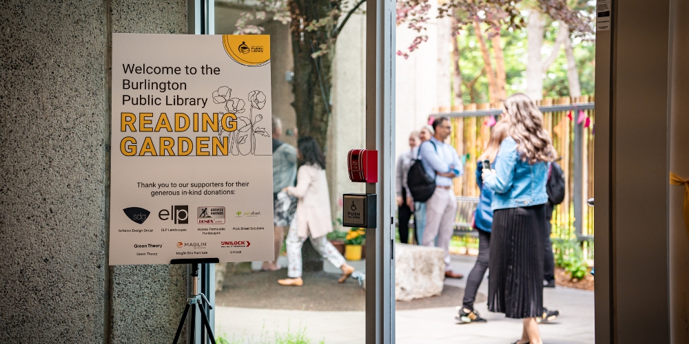 A sign acknowledging donors stands outside the door to the Reading Garden