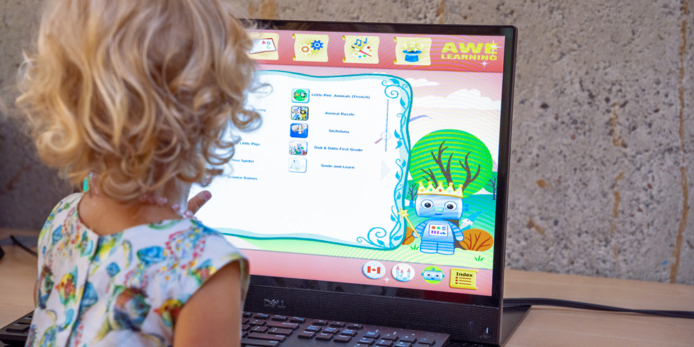 child using an early years literacy computer