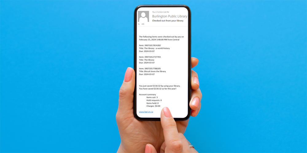 hands holding a mobile phone displaying a checkout receipt for three books showing $118.32 saved by using the library