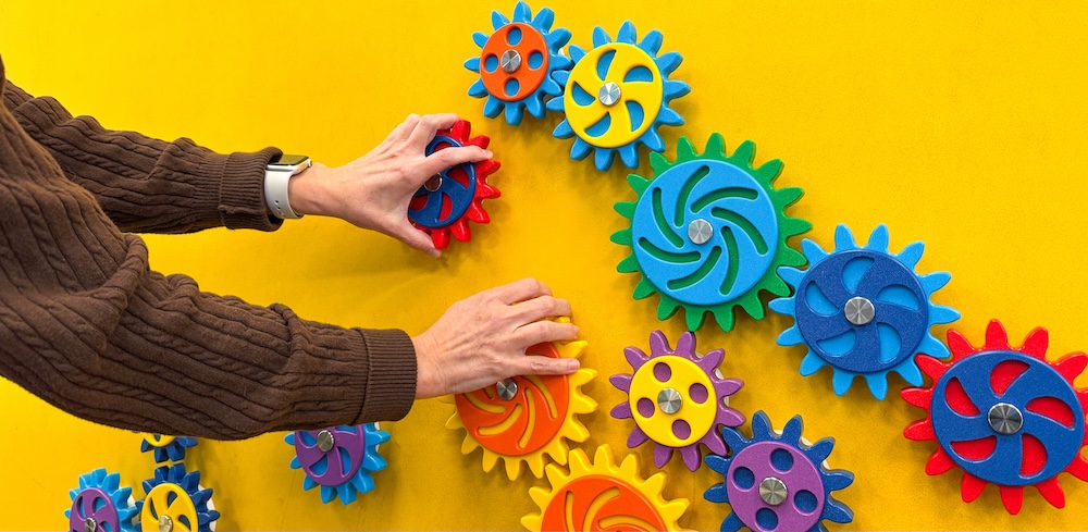 a brightly-coloured magnetic play wall with gears